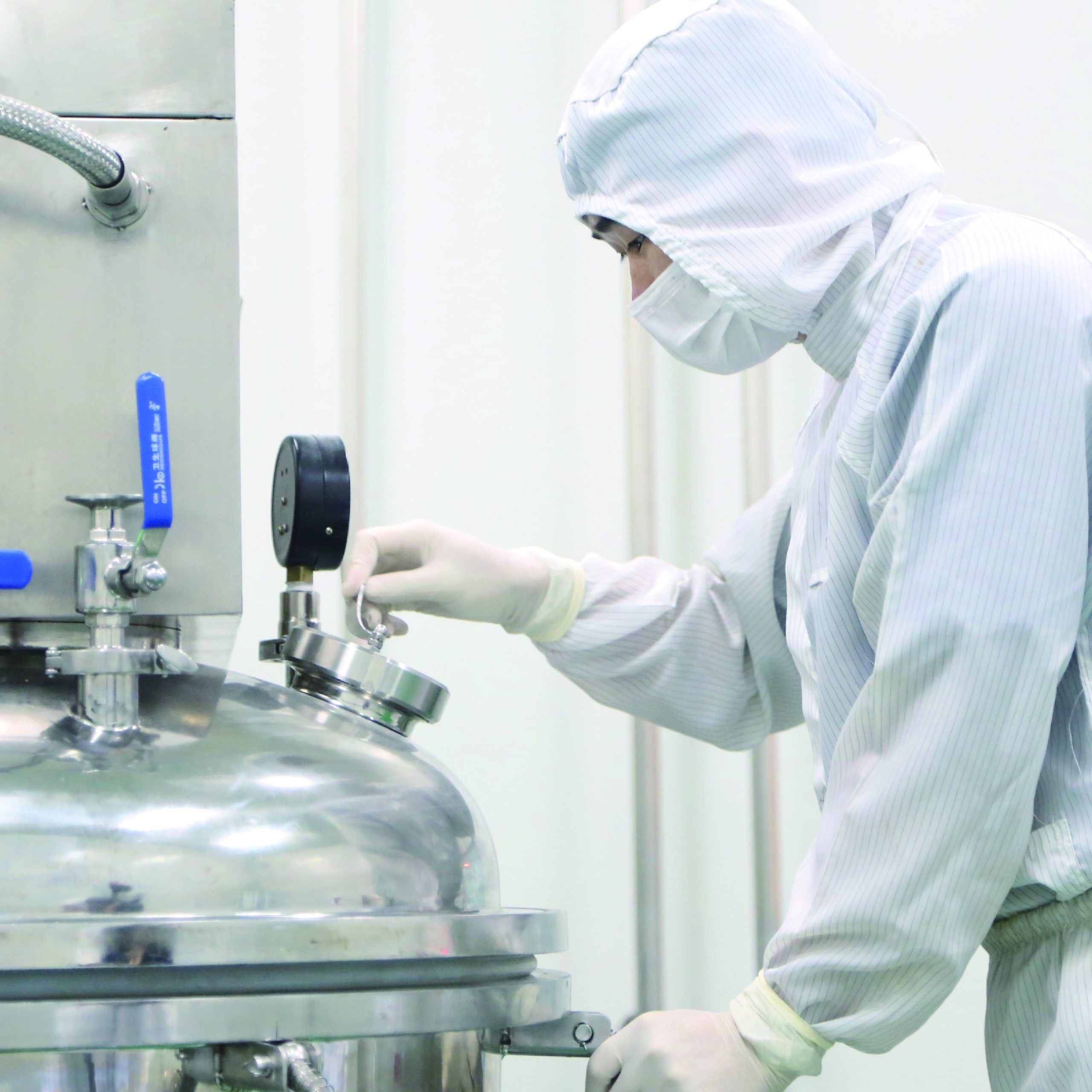 Erkang Pharmaceutical employees are checking raw material barrels